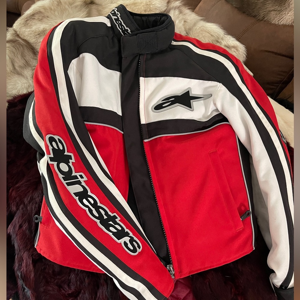 Alpinestars women’s red/white/black motorcycle jacket with armor. Size XS.